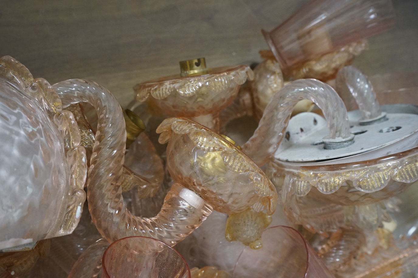 A collection of Murano pink glass wall lights and glasses